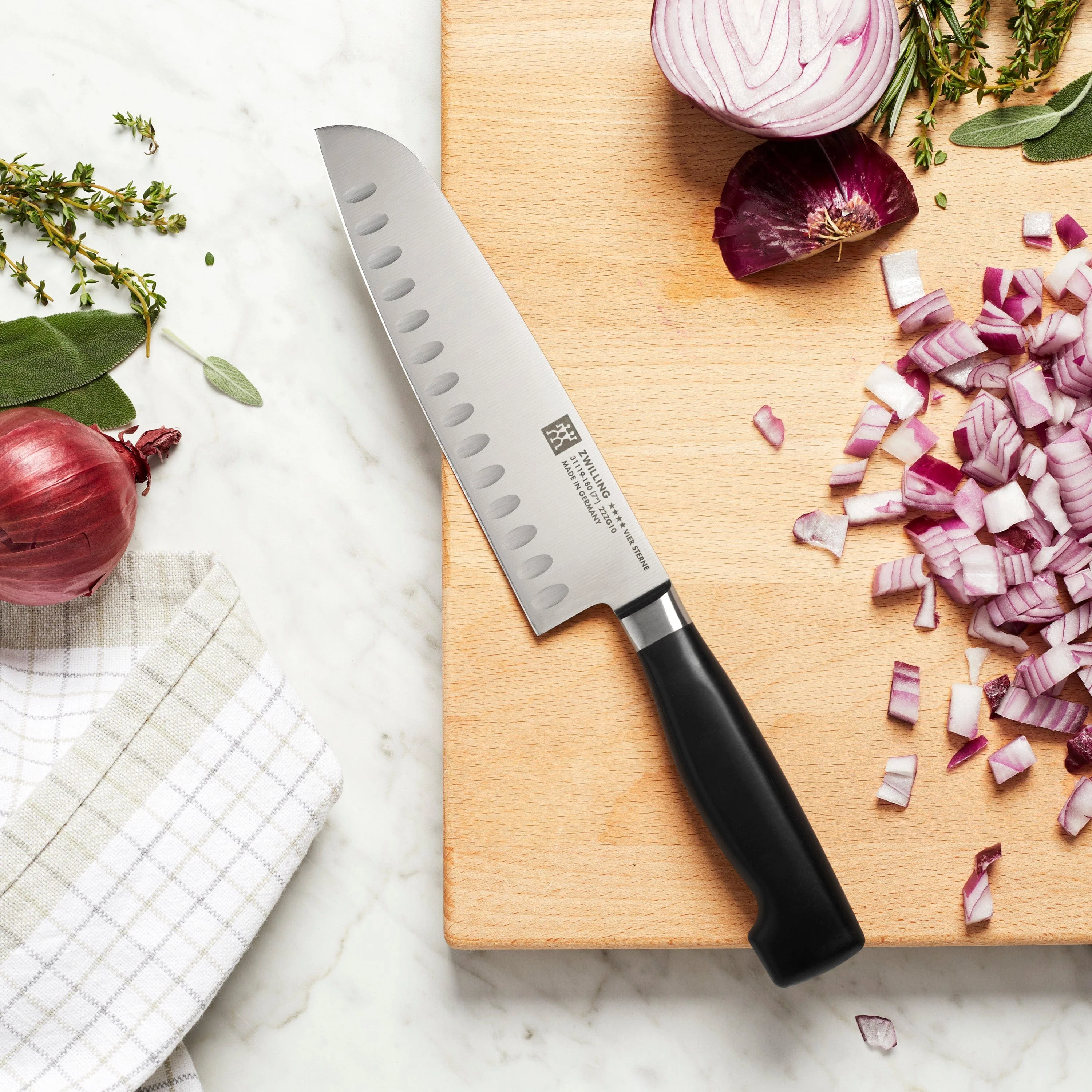 Zwilling Four Star 7-inch Hollow Edge Santoku Knife - Image 2